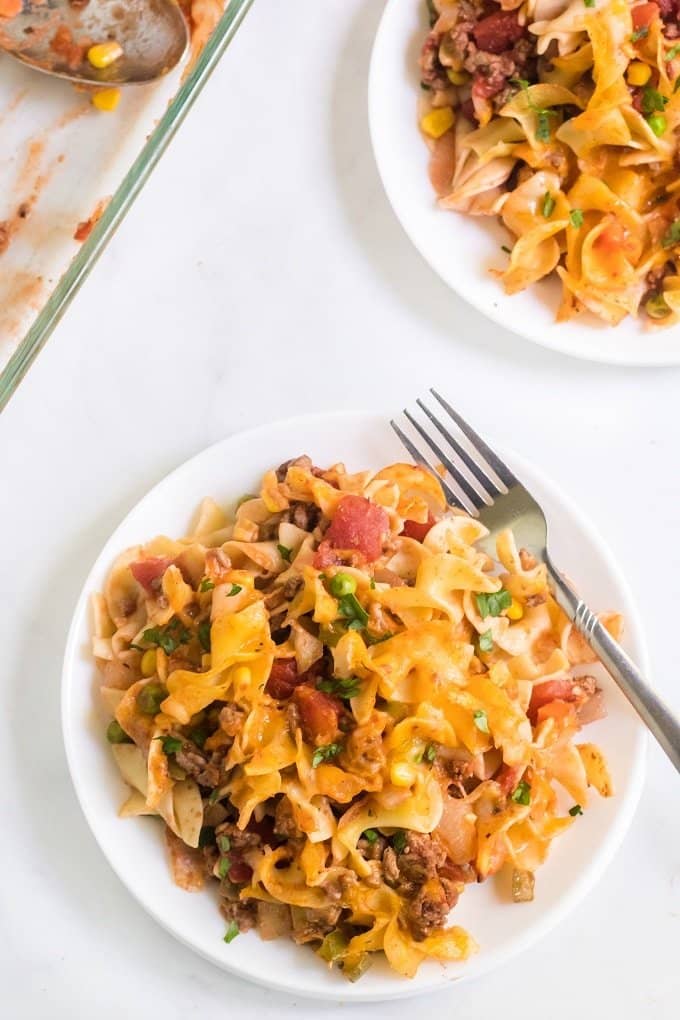 easy Hamburger Dinner Casserole on a white plate with a fork