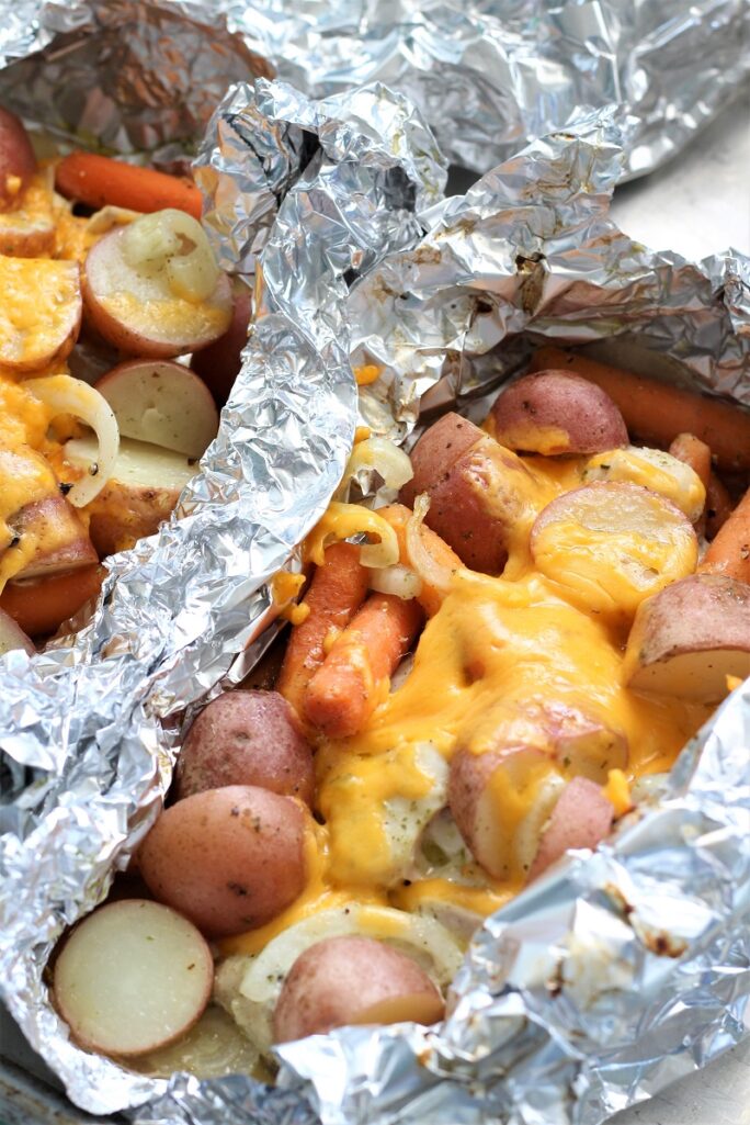 A variety of colorful and delicious foil packets for the oven featuring chicken foil packets, vegetable foil packets, and seafood foil packets in aluminum foil.