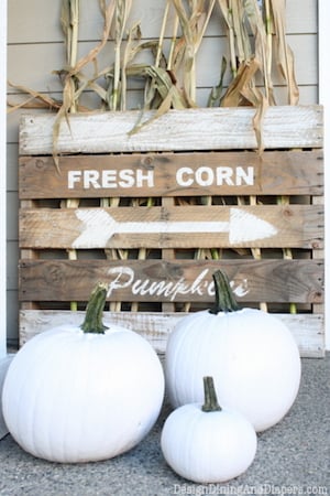 Neutral Front Porch with white pumpkins and corn stalks