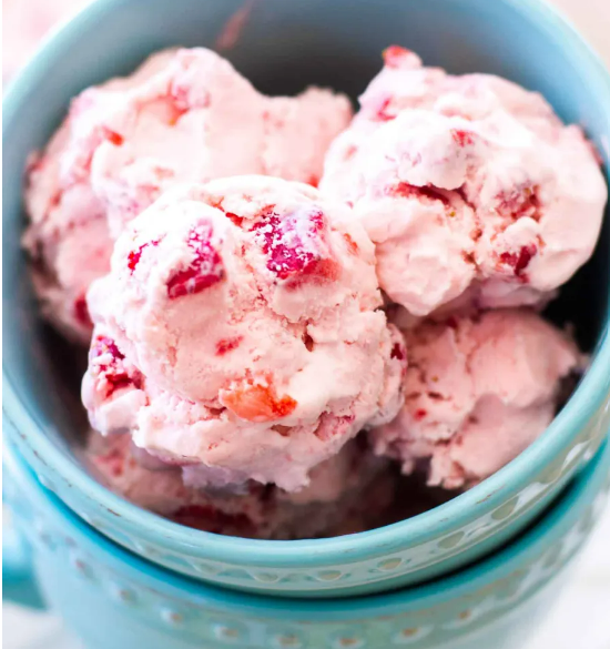 A variety of homemade ice cream flavors including strawberry, vanilla, and mint chocolate chip in colorful bowls.