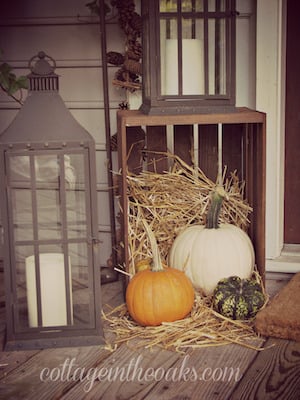 Rustic Fall Front Porch with crate, hay, lantern and pumpkins