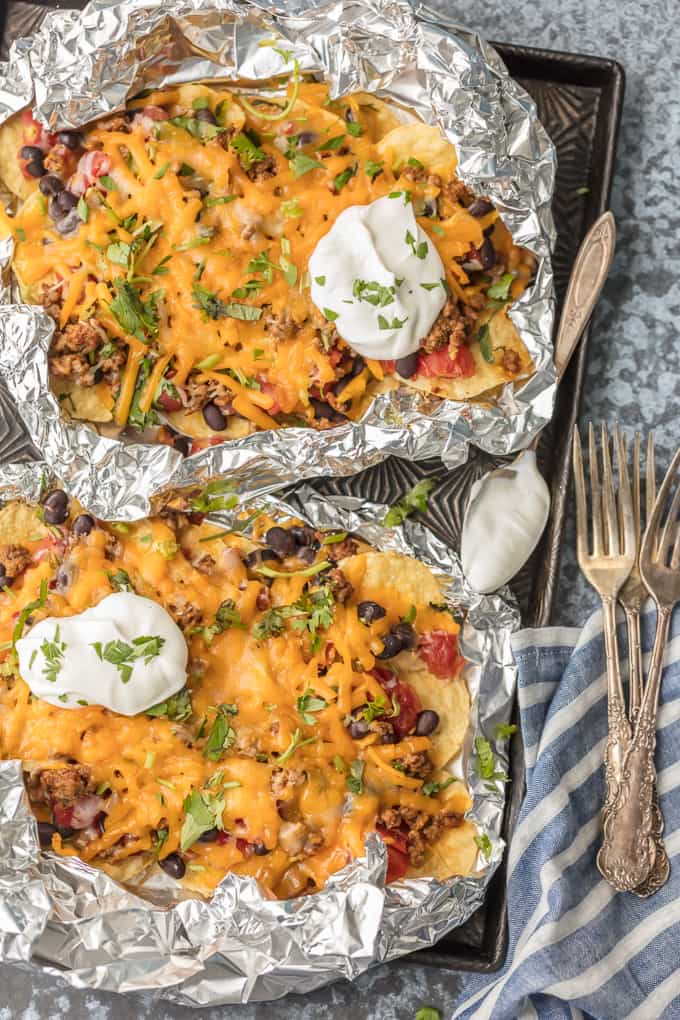 A variety of colorful and delicious foil packets for the oven featuring chicken foil packets, vegetable foil packets, and seafood foil packets in aluminum foil.