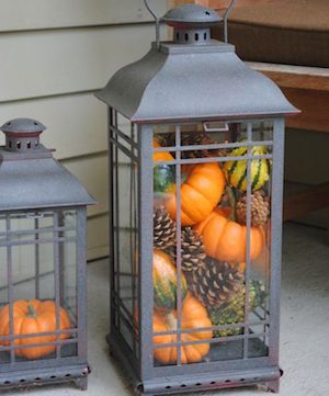 Fall Lantern filled with pinecones, pumpkins and gourds